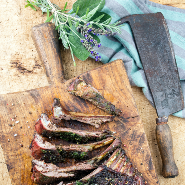 BBQ Ribs and herbs on a cutting board