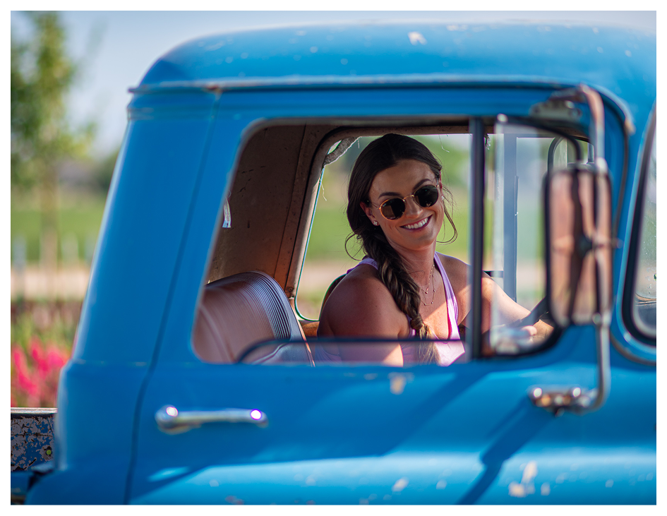 Woman Smiling out of a vehicle window